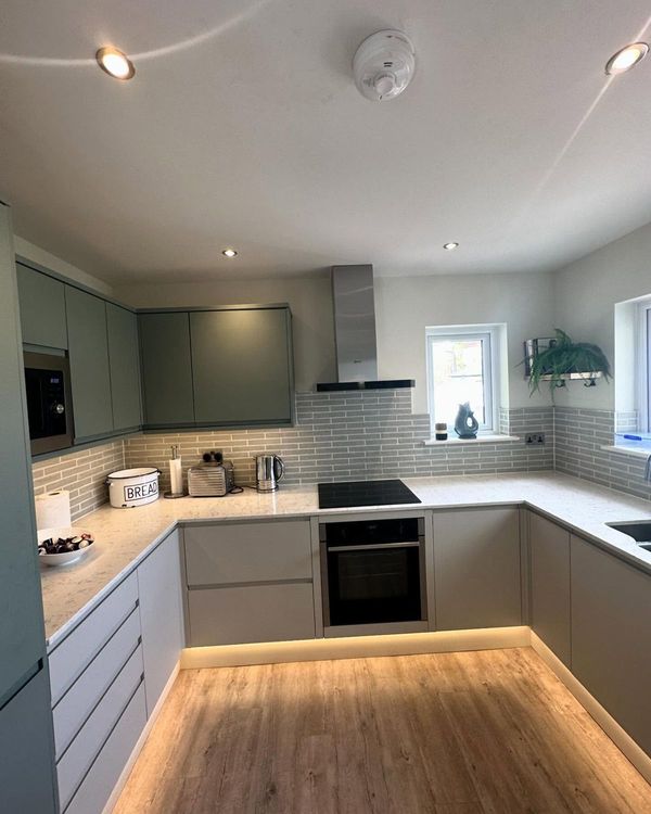 Finished kitchen with downlights and plinth lighting