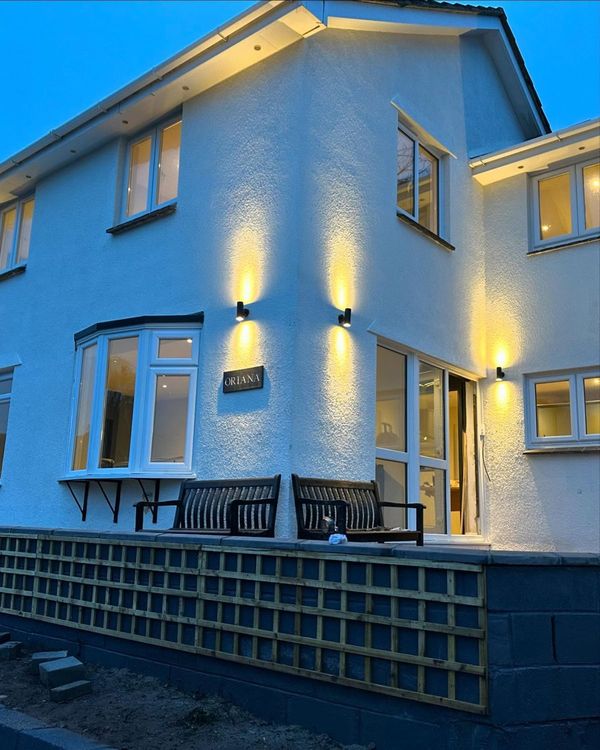 Rear of house with up-and-down wall lights