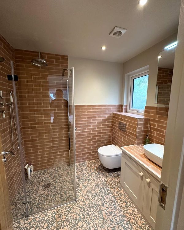 Shower room with downlights and extractor